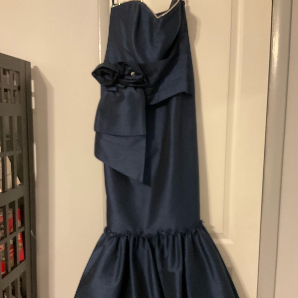 Long strapless gown and jacket. Top is a size 10 narrower through hips.